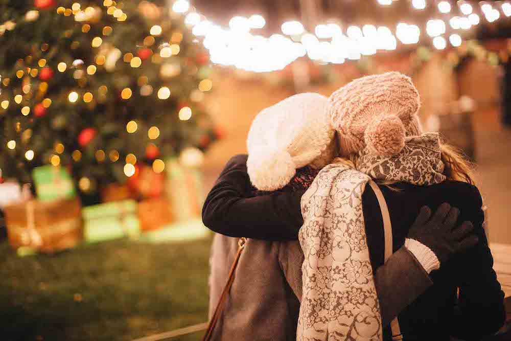 Friends enjoy the holiday lights