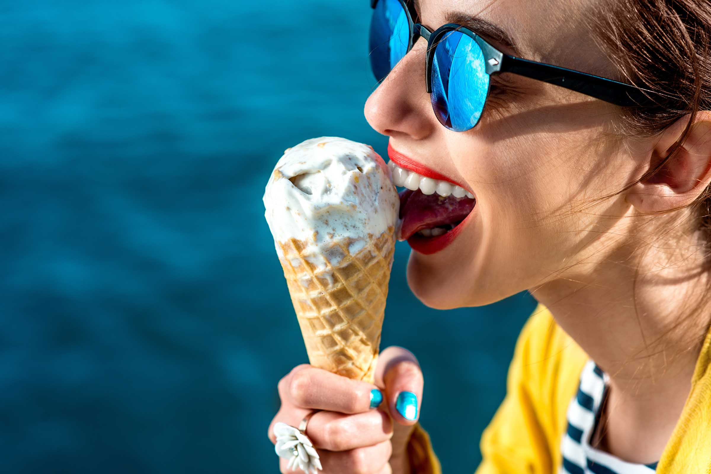 woman licking an ice cream cone