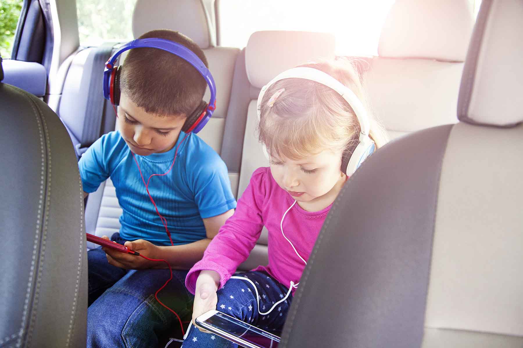 Kids playing games in the car